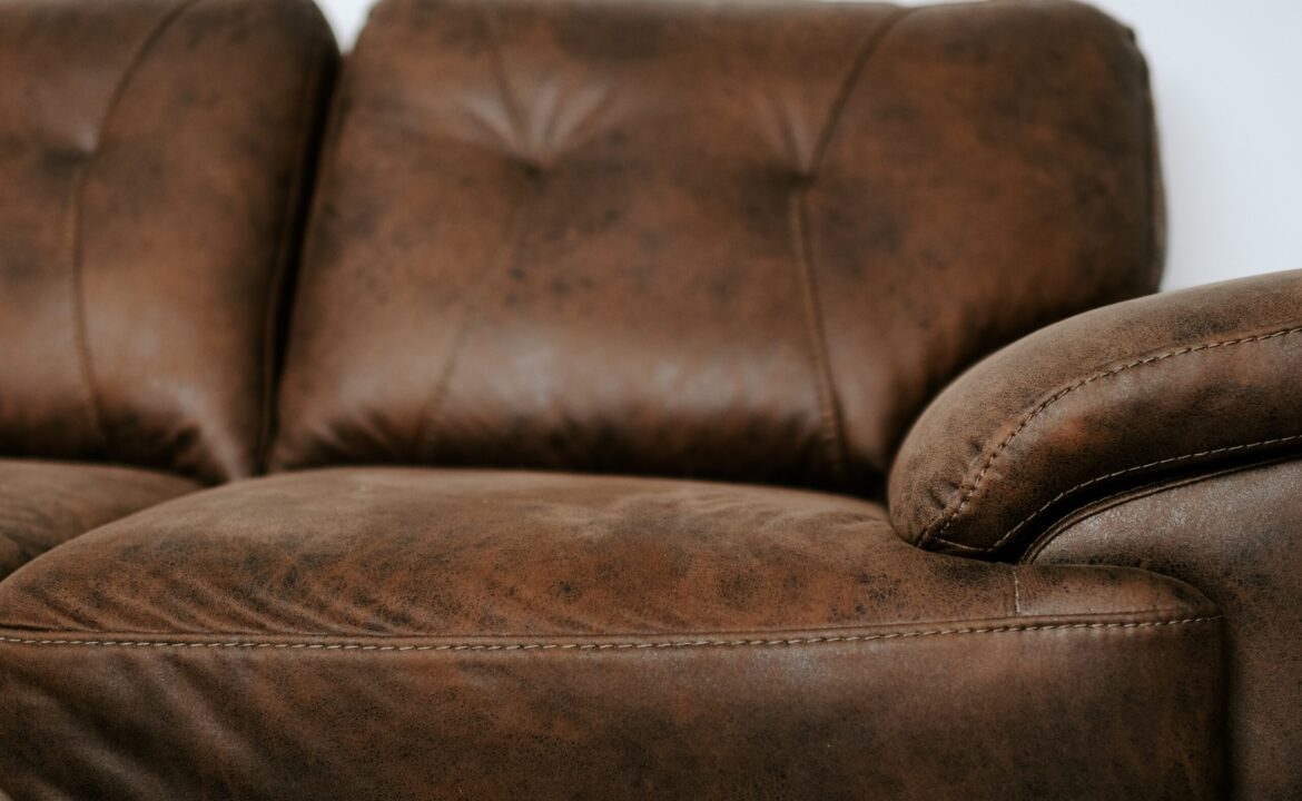 a-brown-leather-couch-XTSXVQ3-scaled